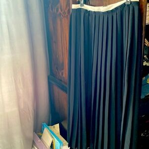 Simply, Vera Wang black pleaded skirt. Maxi length with white band. Size medium.